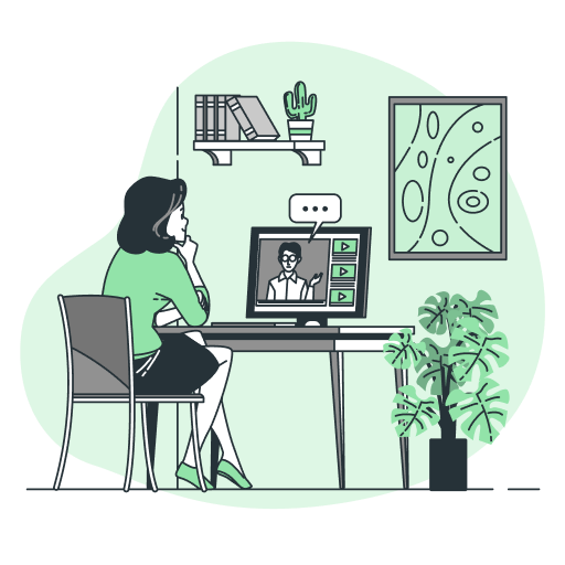 Женщина за столом смотрит видео на компьютере, рядом полка, картина и растение.
